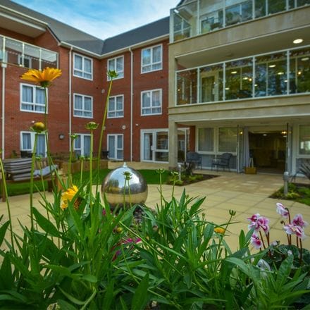 Flowers in a landscaped garden outside a care home