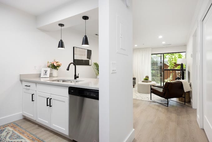 Interior view of a modern assisted living apartment with kitchenette