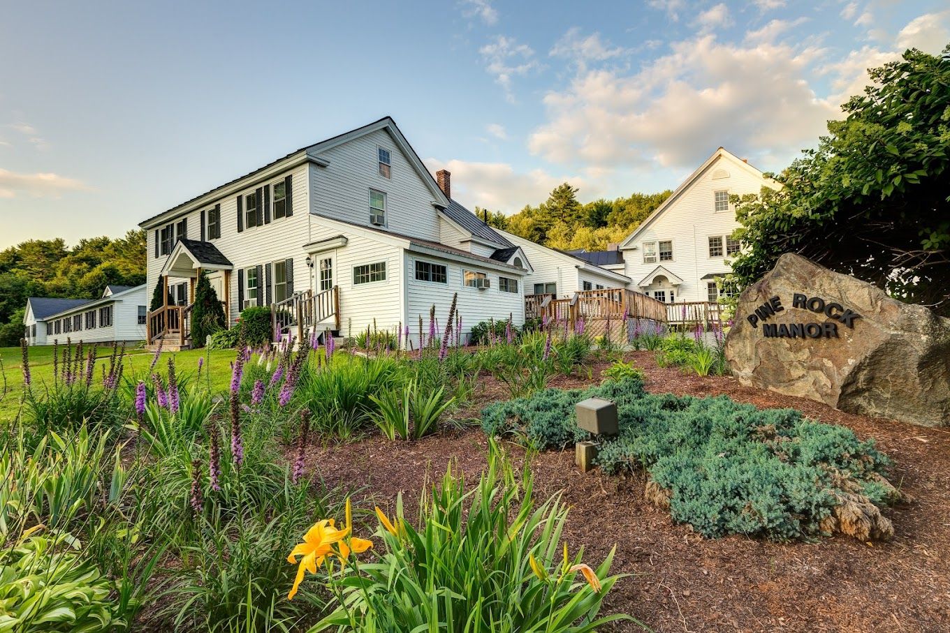 Exterior view of Pine Rock Manor with gardens