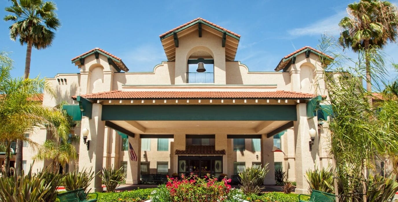 Front view of Rio Las Palmas facility with palm trees
