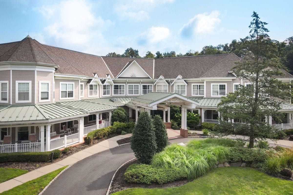 Exterior view of Sunrise at West Essex with landscaped entrance