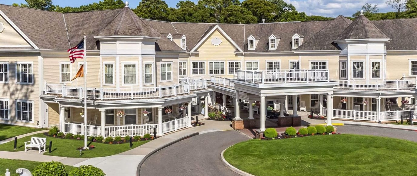 Exterior view of Sunrise of East Setauket with landscaping