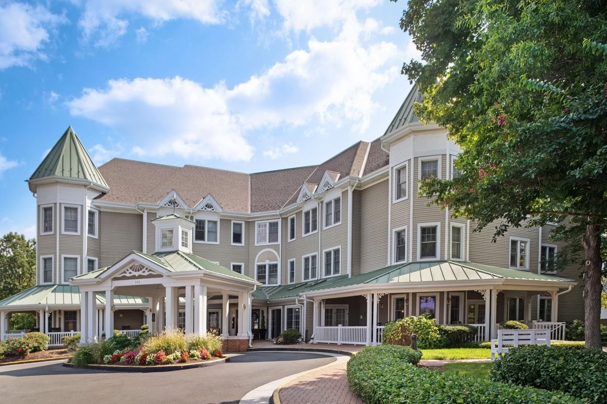 Exterior view of a senior living facility with landscaping