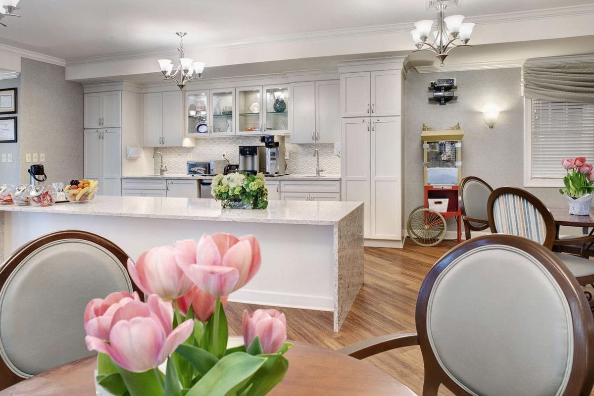Bright common area featuring a kitchenette and dining space