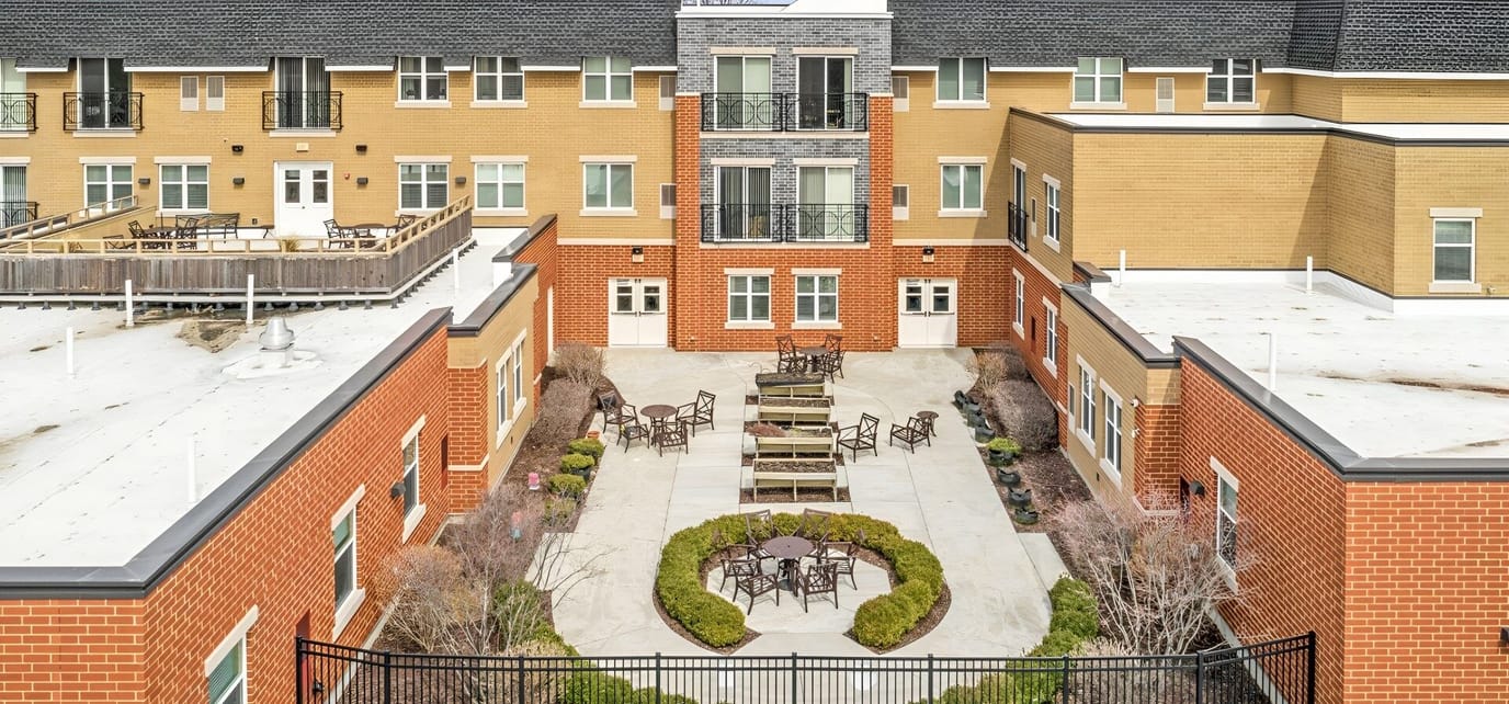 Aerial view of a landscaped outdoor area with seating