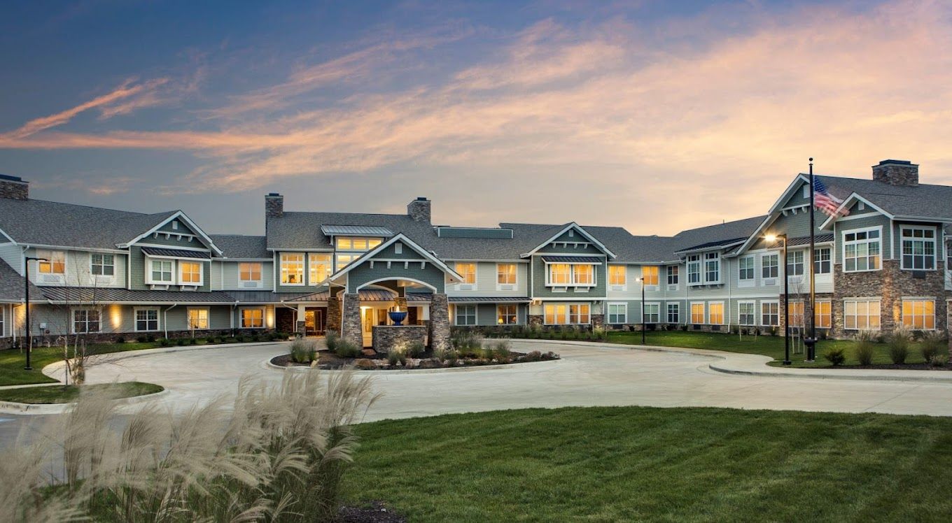 Exterior view of Burlington Creek Senior Living at sunset