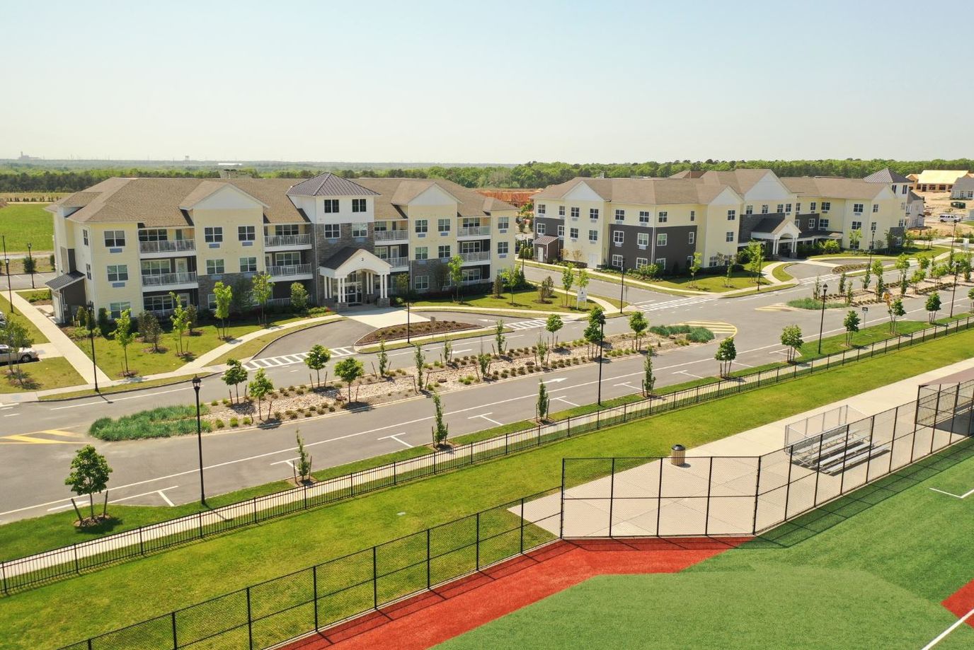 Aerial view of a senior living facility with landscaped gardens
