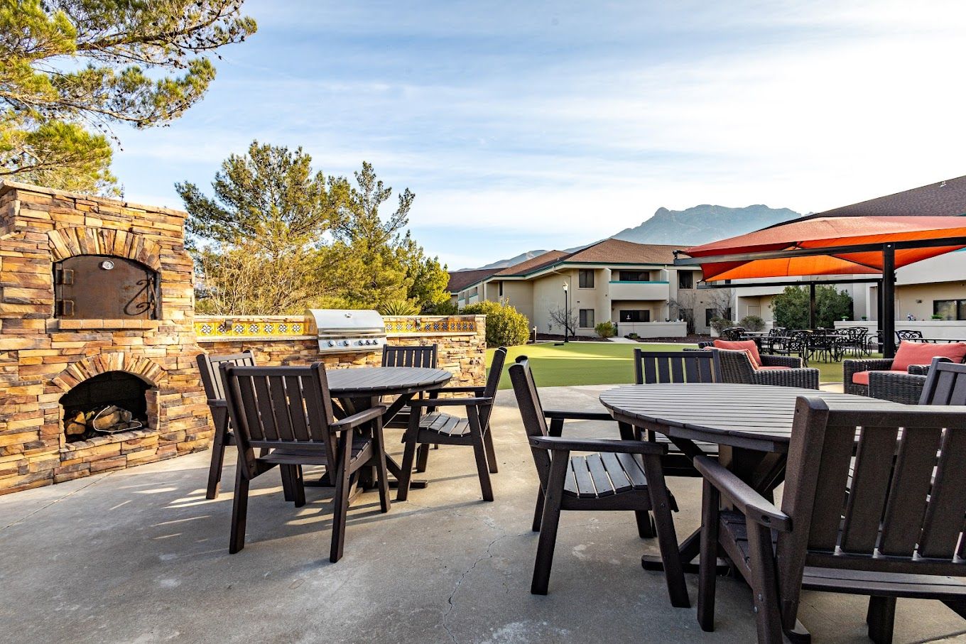 Outdoor seating area with barbecue and mountain views