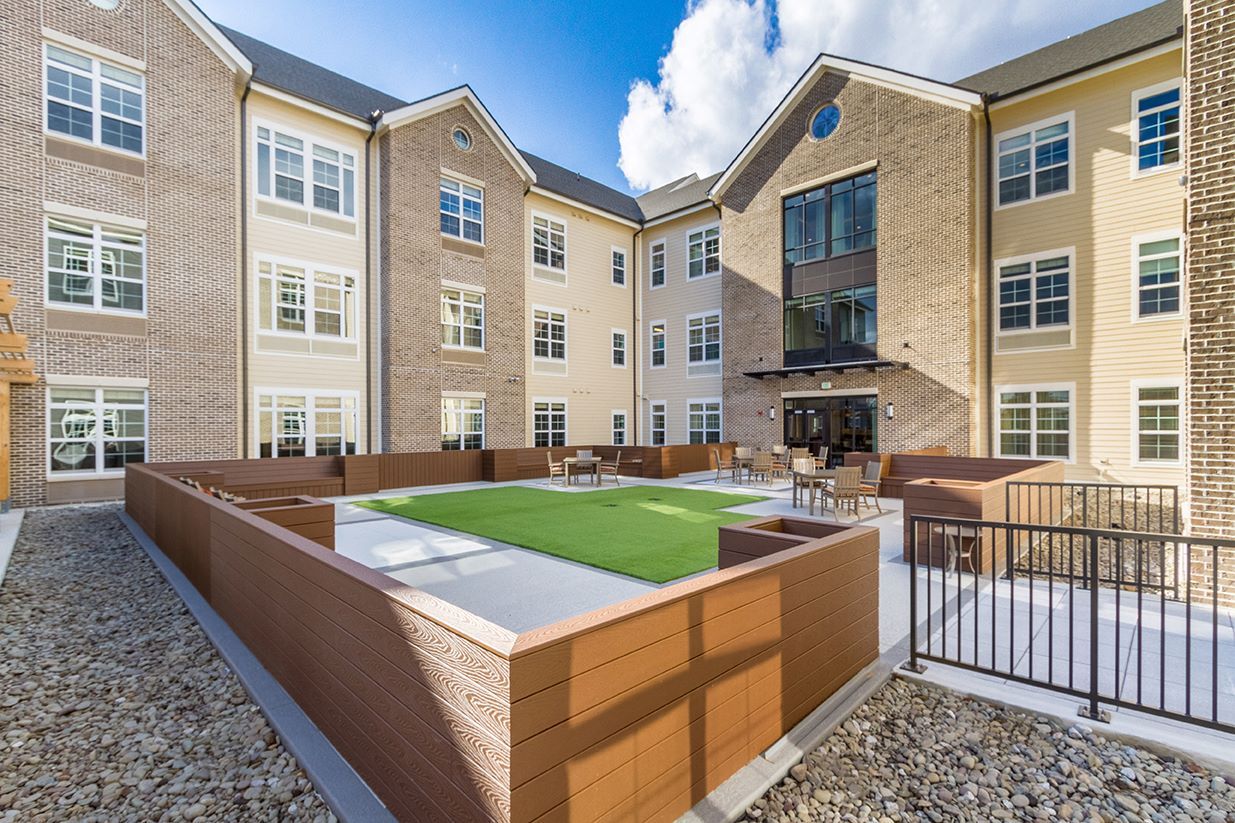 Outdoor courtyard with seating and greenery