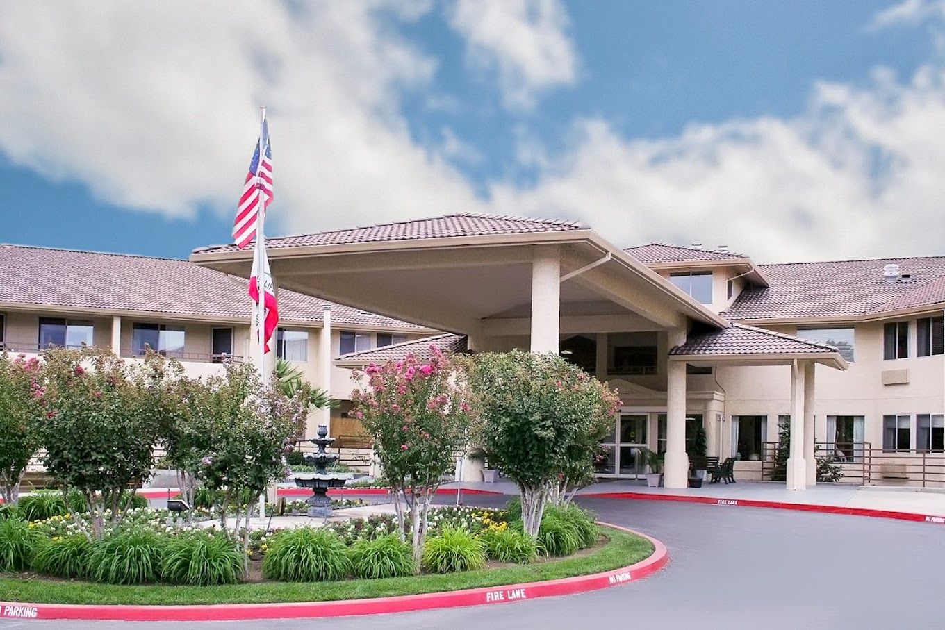 Exterior view of a senior living facility with landscaping