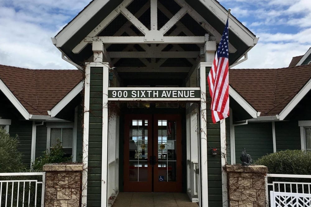 Entrance of Vista Terrace of Belmont with American flag