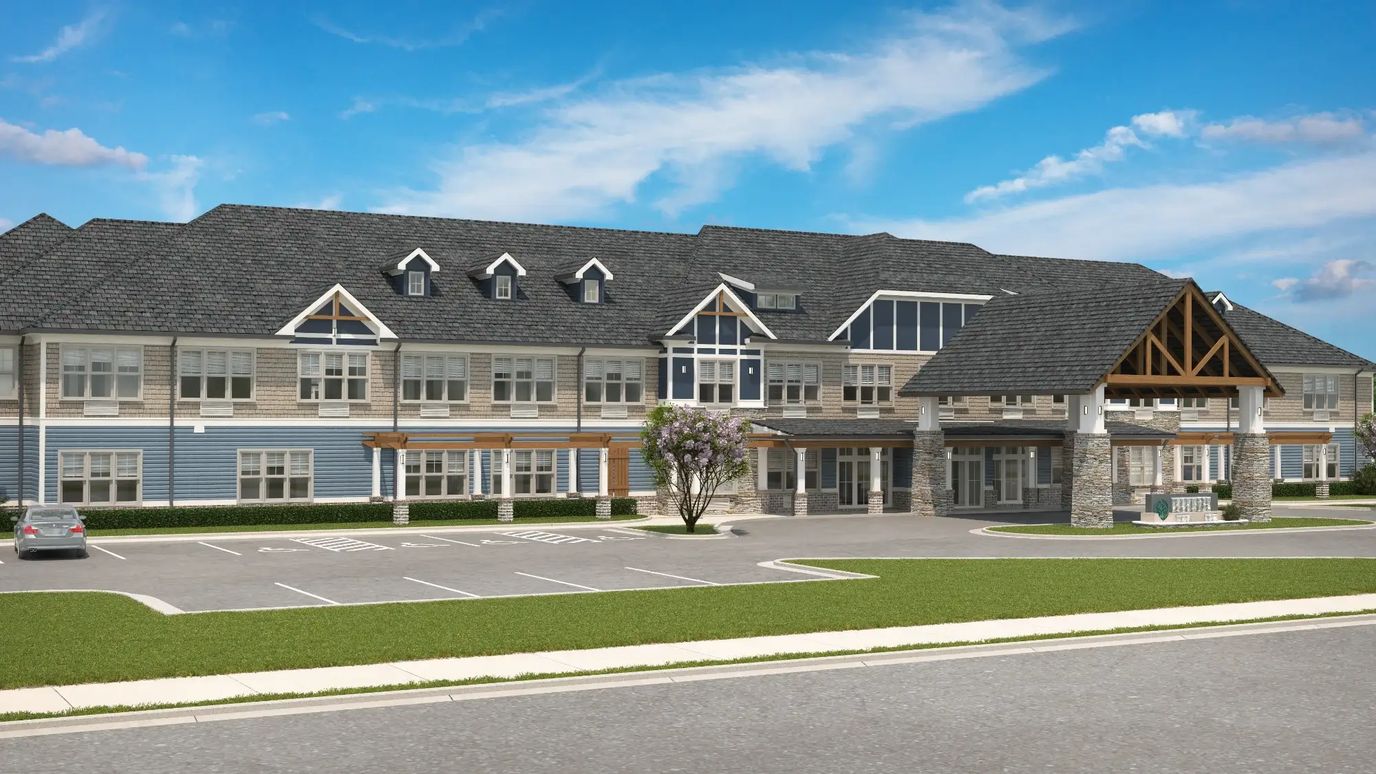 Exterior view of Oaks at Aiken facility with parking area