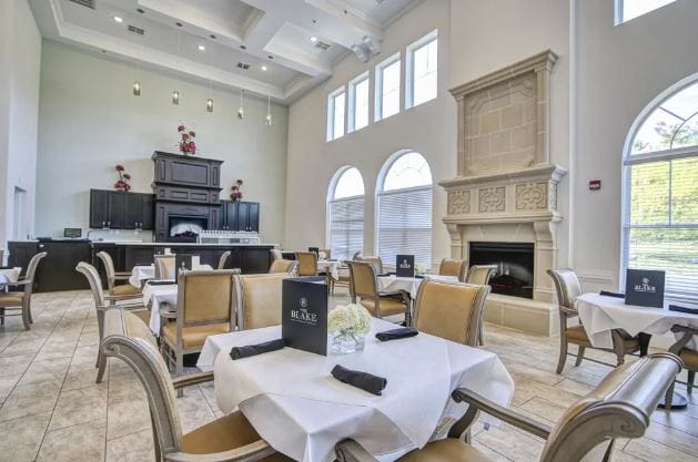 Elegant dining area with tables set for residents