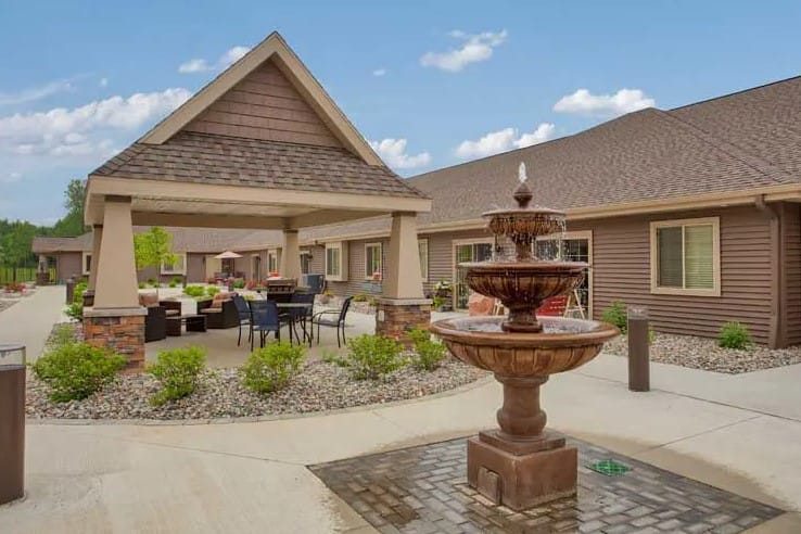 Outdoor space with fountain and seating area