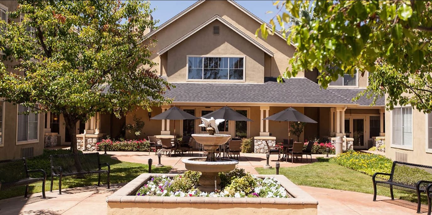 Outdoor courtyard with seating and a fountain