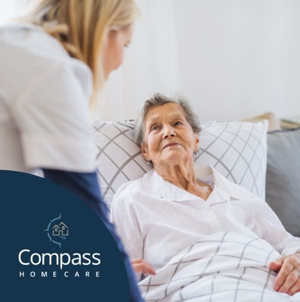 A caregiver talking with a senior resident.