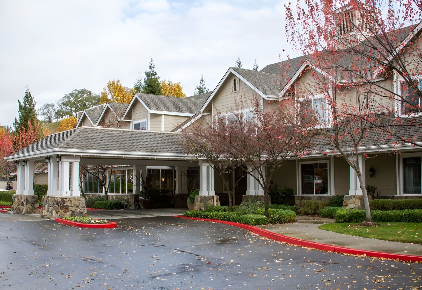 Exterior view of Sunrise of Danville with autumn trees