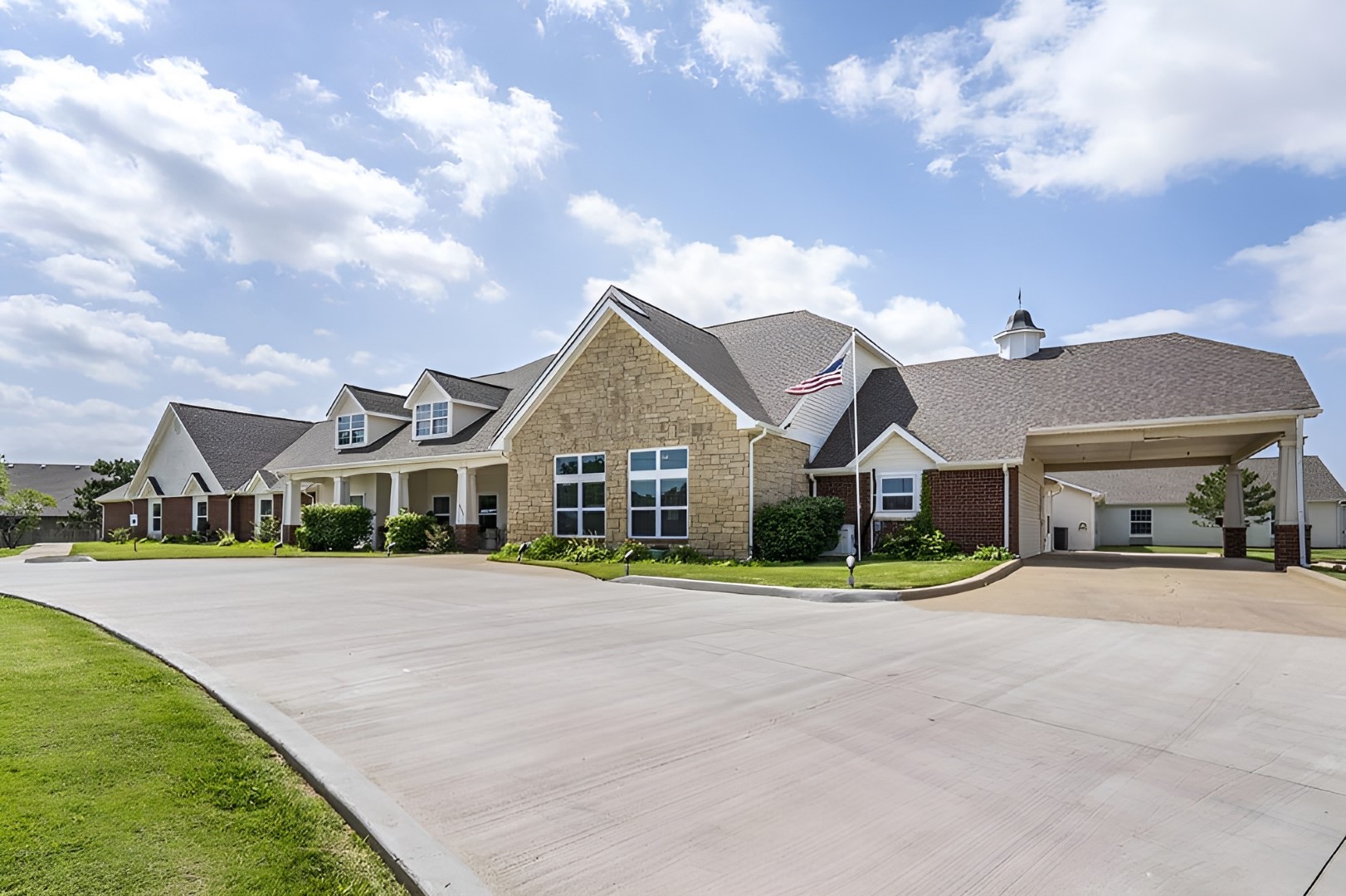 Exterior view of Brookdale Enid with landscaped entrance