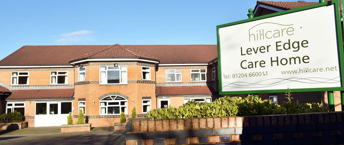 Exterior view of Lever Edge Care Home with signage