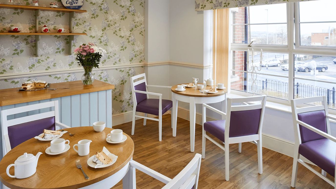 Cozy dining area with tables and tea set
