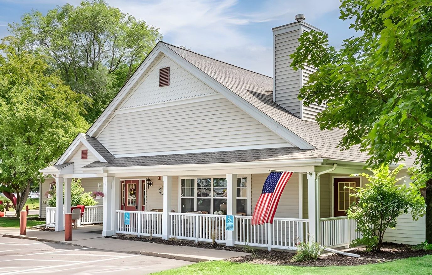 Exterior view of a nursing home with an American flag