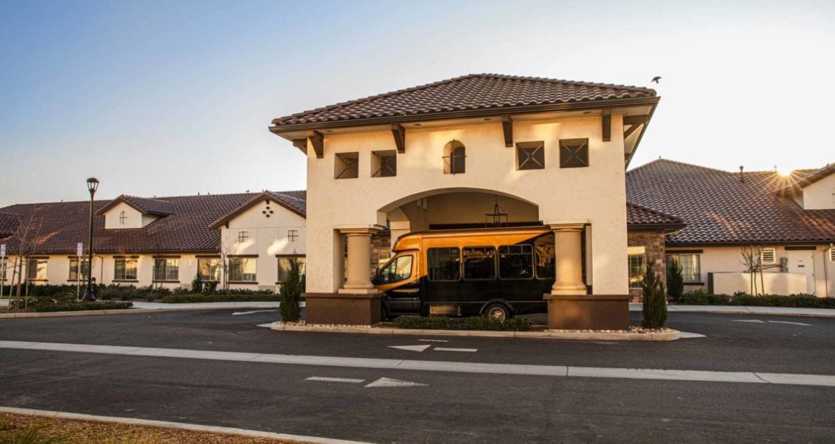 Front entrance of El Rio Memory Care Community with facility transport