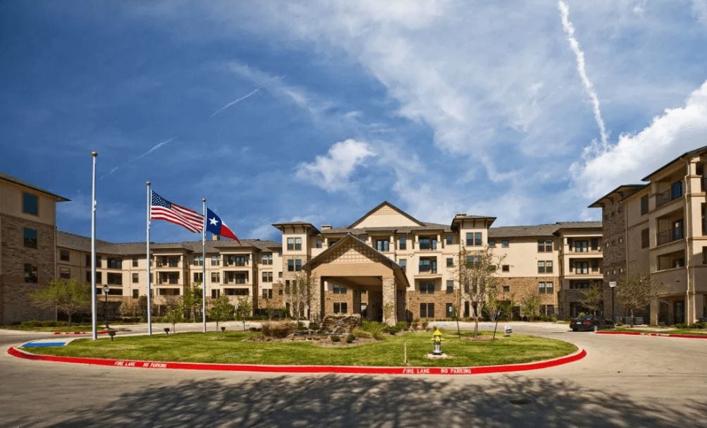 Exterior view of Lakeview at Josey Ranch with flags