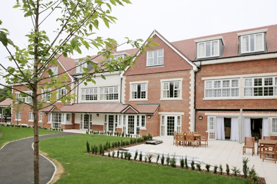 Exterior view of Lavender Fields Care Home with garden