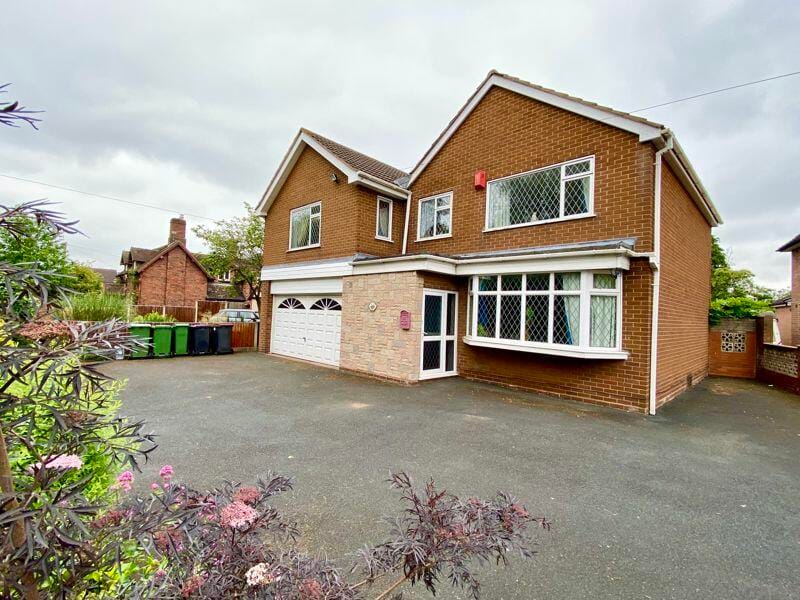 Exterior view of a residential building with garage