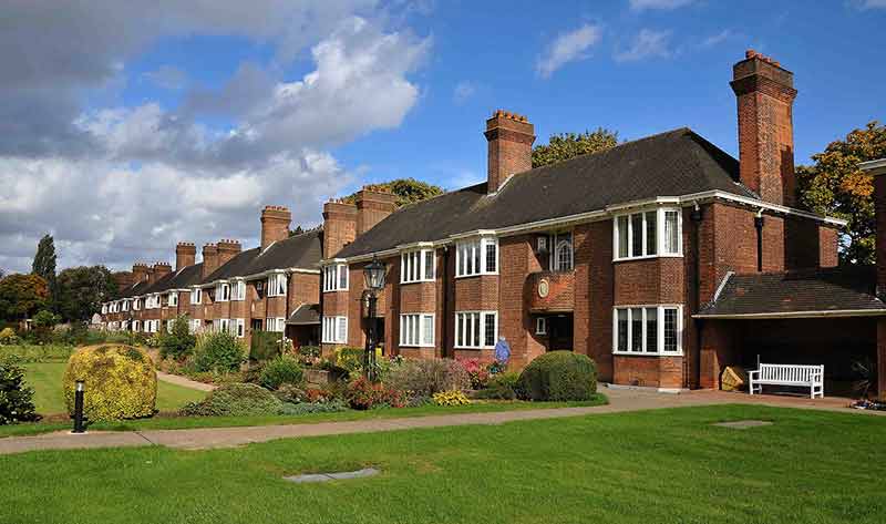 Exterior view of a residential building with gardens