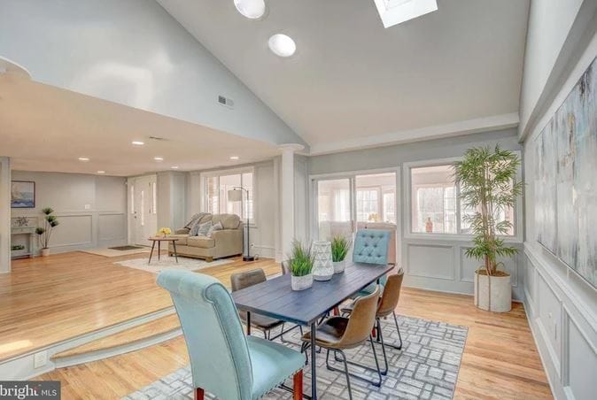 Bright and airy common area with dining and living spaces