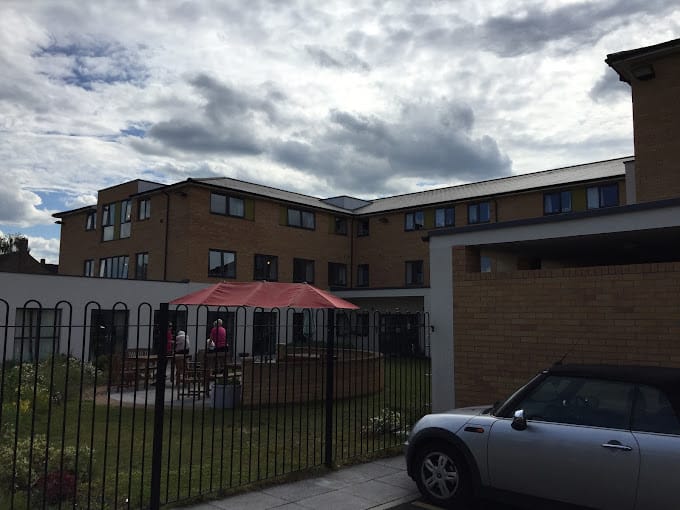 Exterior view of Clifton View Care Home with outdoor seating