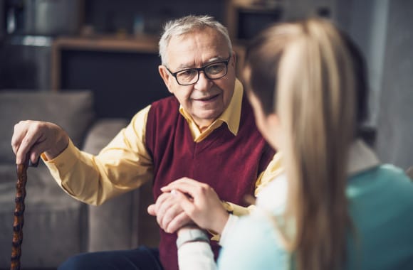 Nurseplus Care at Home, home care in Plymouth, UK — Senior resident conversing with caregiver in a cozy setting