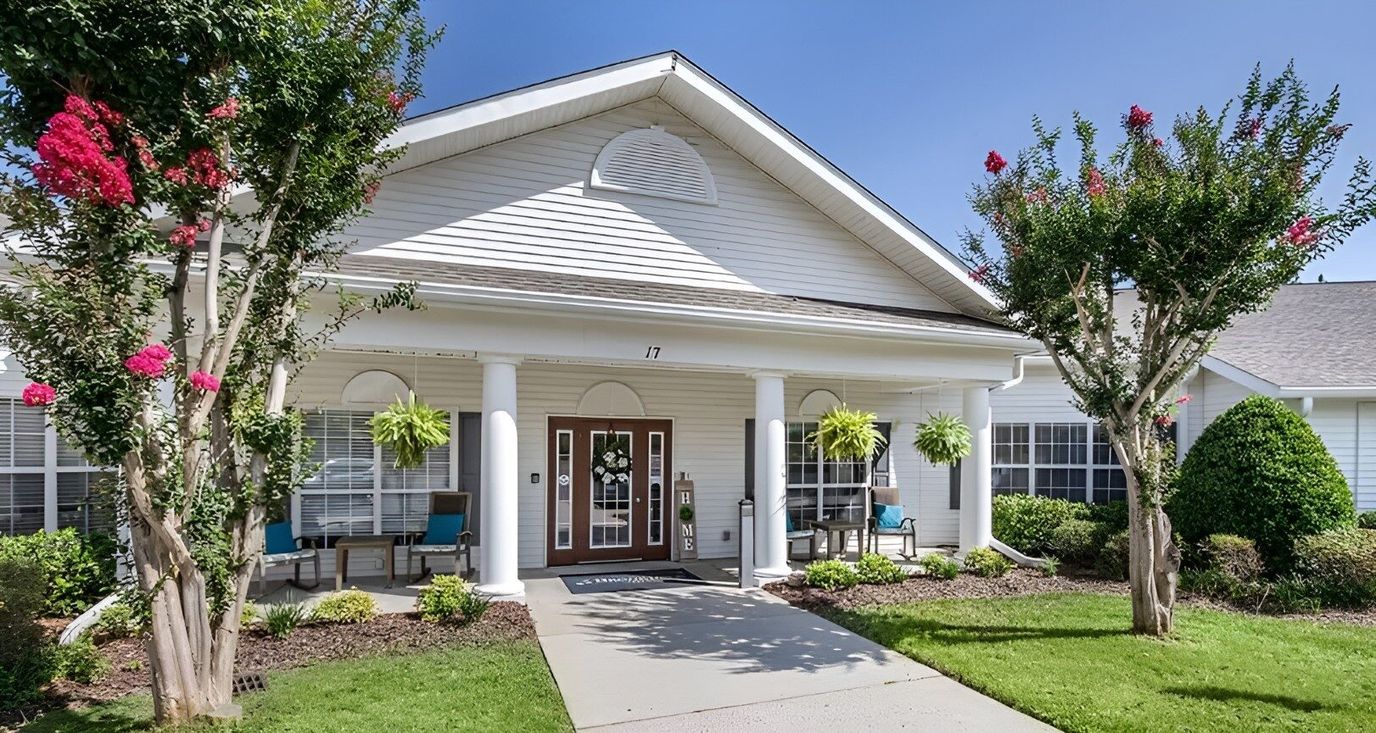 Exterior view of Brookdale Pinehurst entrance with flowers