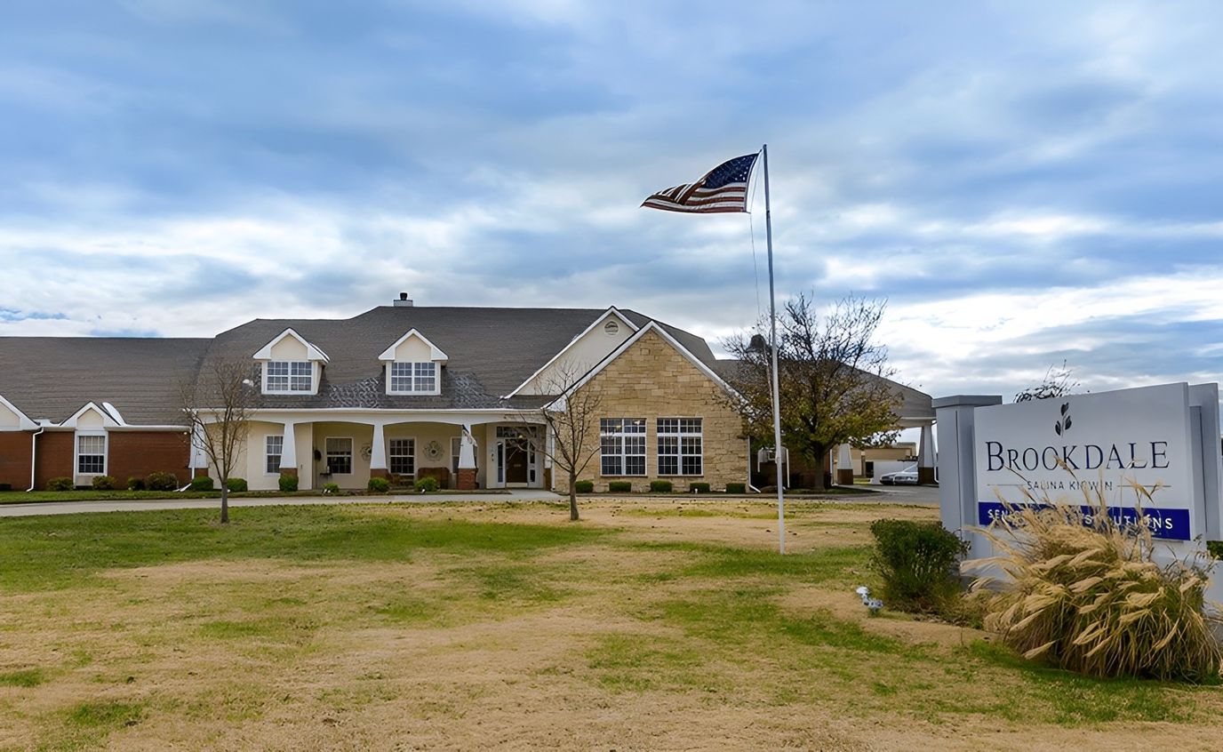 Exterior view of Brookdale Salina Kirwin with flag