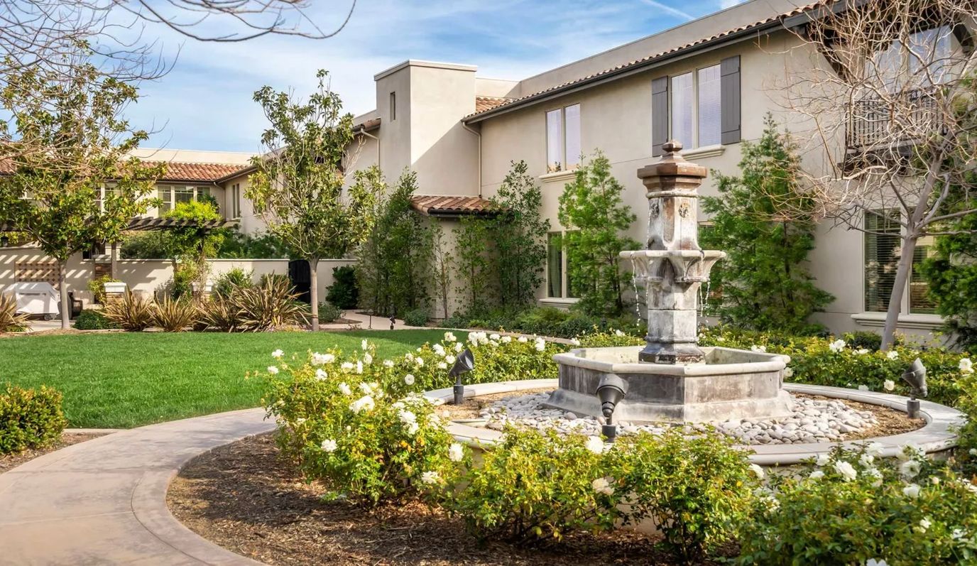 Outdoor area with fountain and landscaping