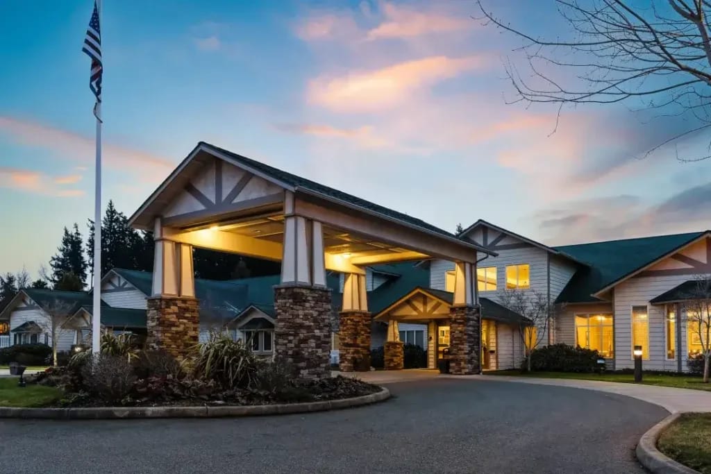 Exterior view of the Sequim Health & Rehabilitation building at dusk