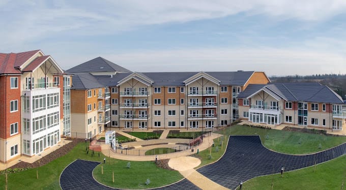 Exterior view of Shenley Wood Retirement Village showing landscaped grounds