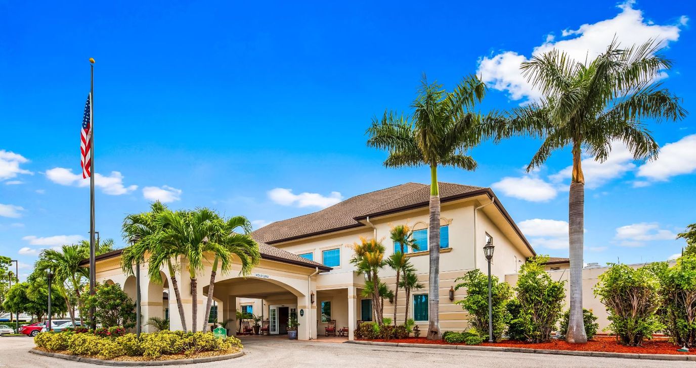 Exterior view of a senior living facility with landscaping