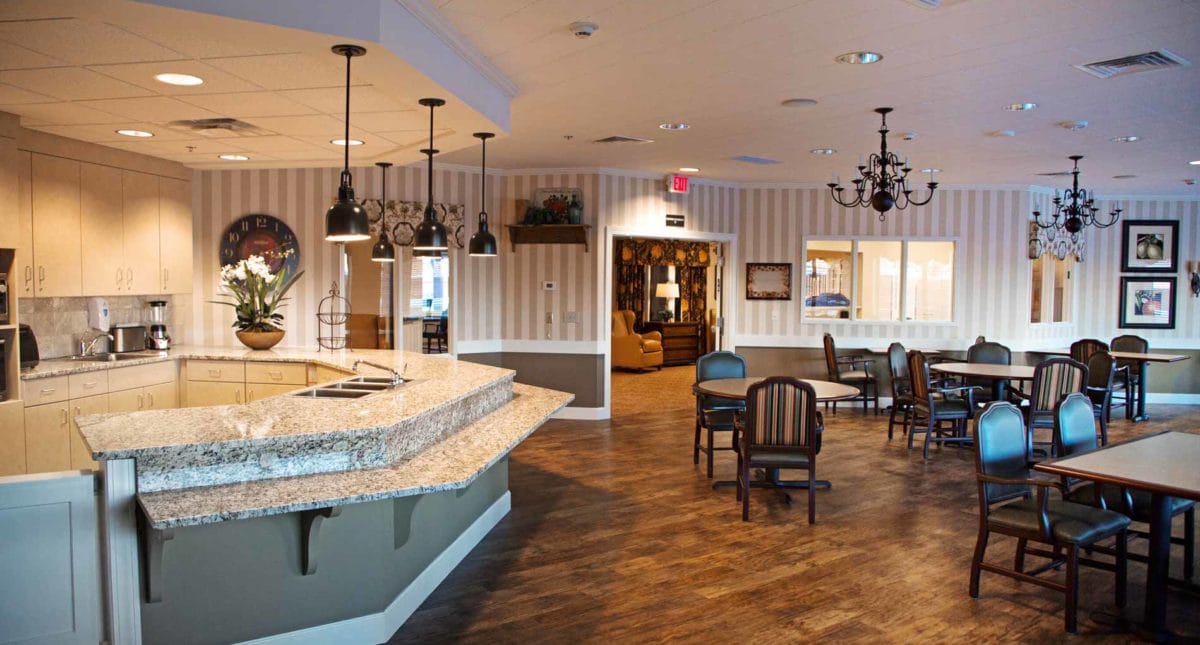 Dining area with seating and kitchen in an interior space