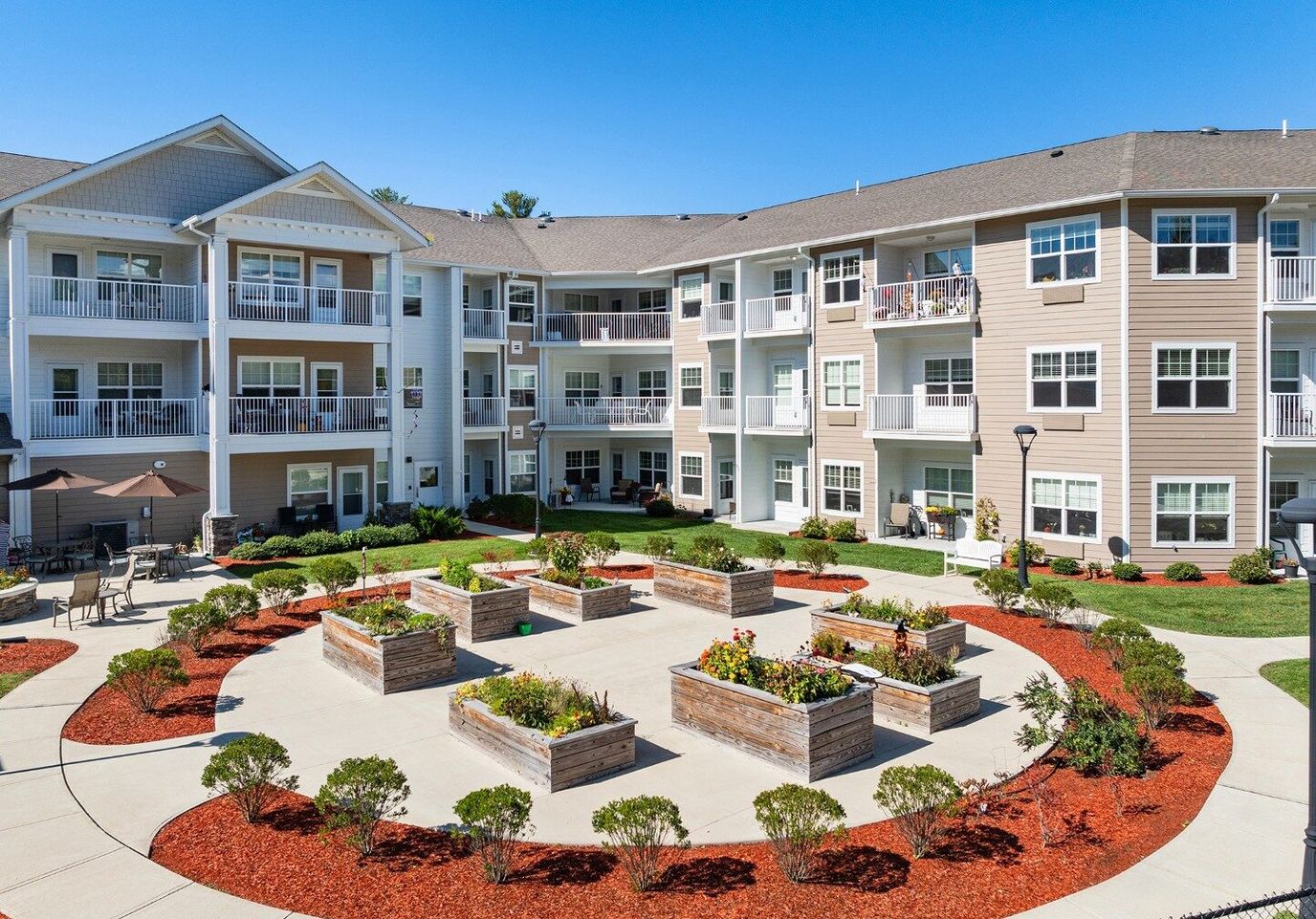 Exterior view of a landscaped courtyard with resident apartments