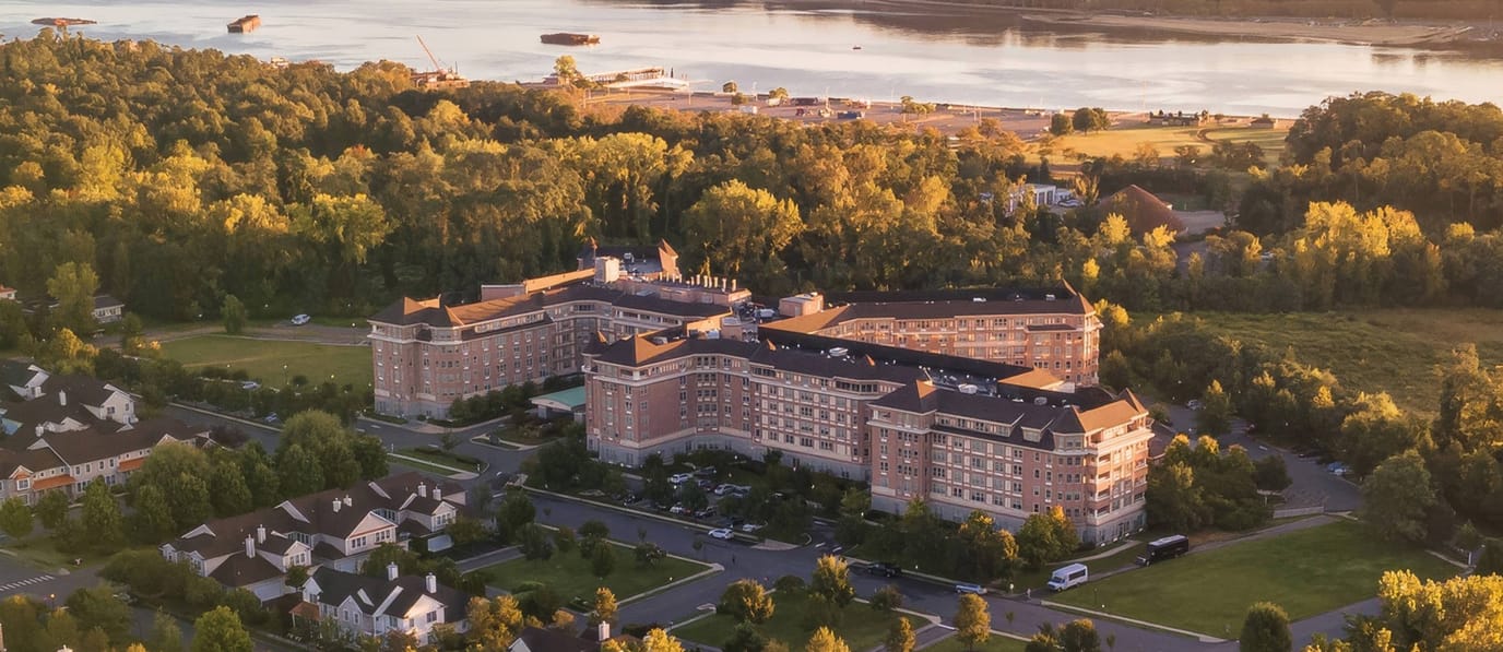 Aerial view of The Sinclair at Port Washington surrounded by greenery