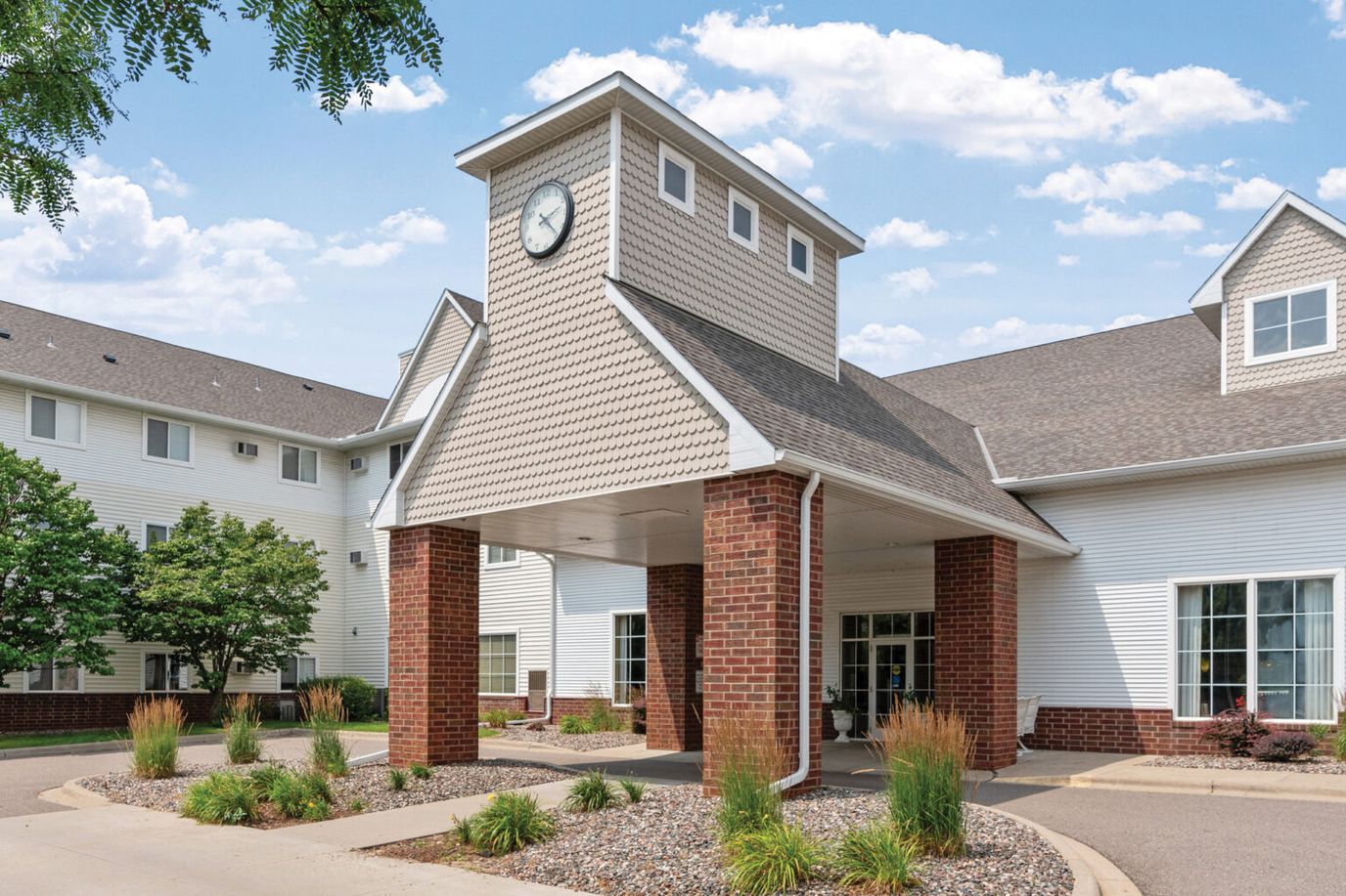 Exterior view of the facility entrance showing clock tower