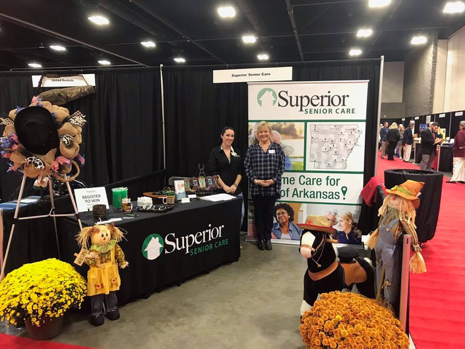 Staff at a promotional booth for Superior Senior Care