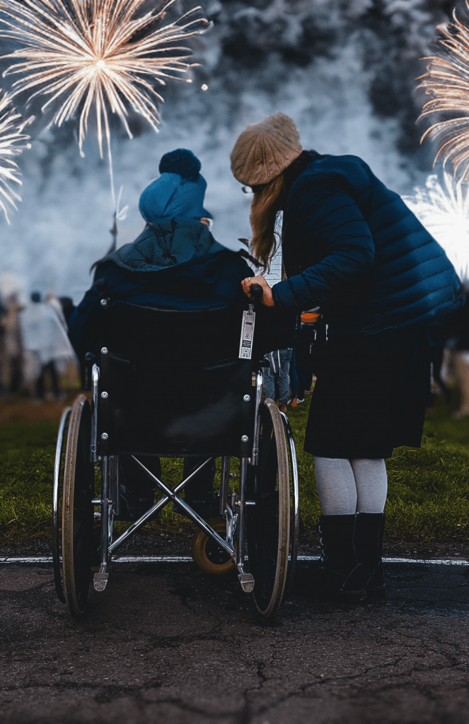 Residents enjoying fireworks together outdoors.