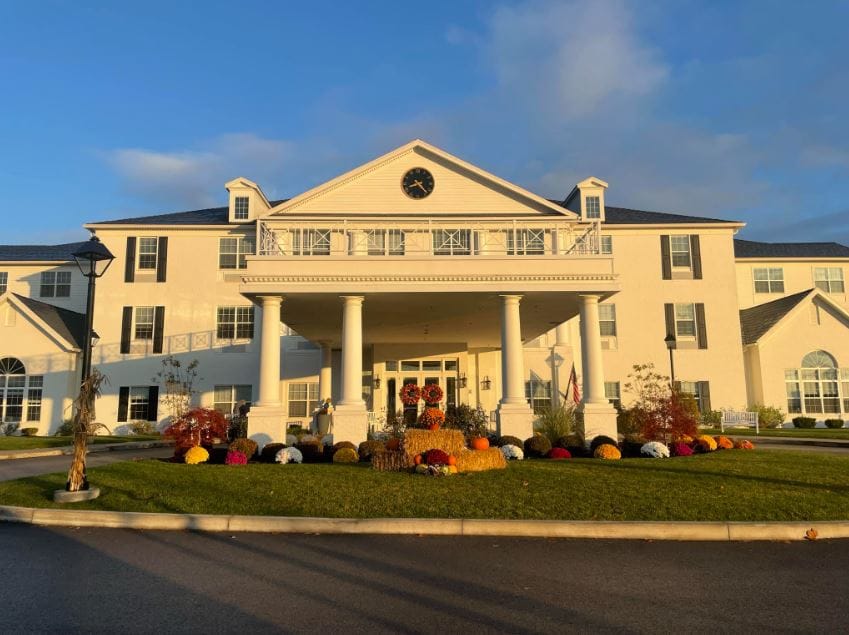Front entrance of Apple Blossom Senior Living with landscaping