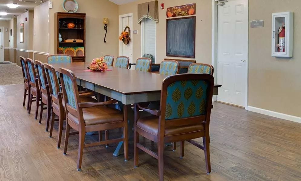 Common area with a large dining table and chairs