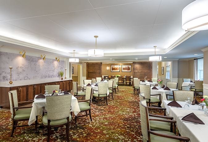 Bright dining room setup with tables and chairs