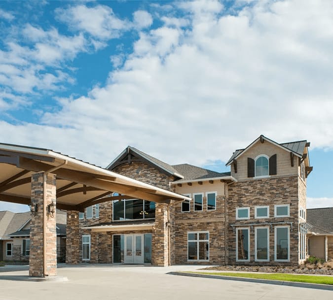 Exterior view of a nursing home building with awning