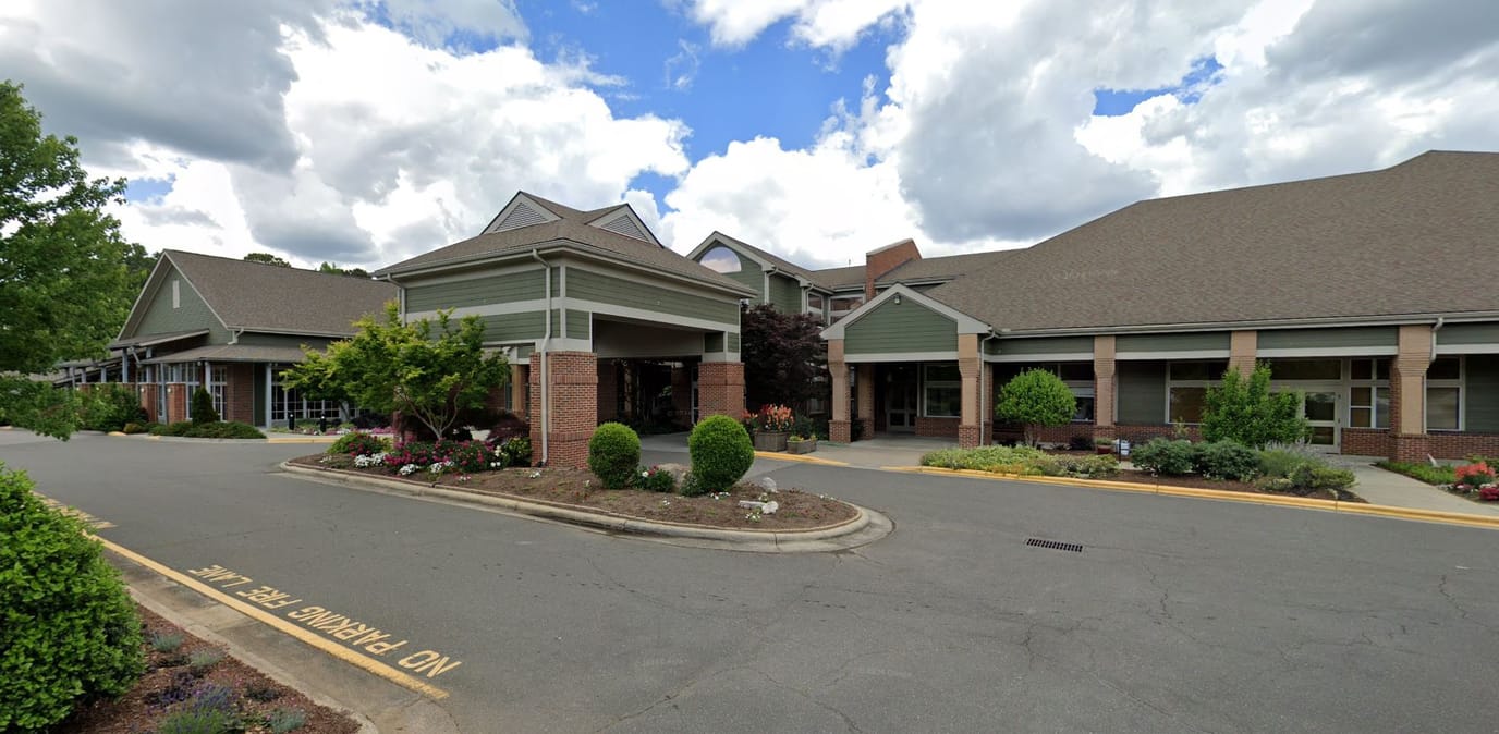 Exterior view of Carolina Meadows facility with landscaping